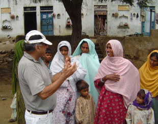 Suri Sehgal listens to village women in India.