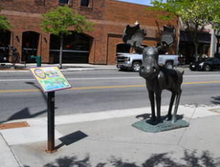 Mudgy and Millie statues and book lead visitors through downtown Coeur d'Alene.