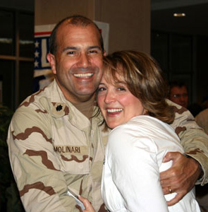 Lisa and her husband, Francis, at one of his deployment homecomings.
