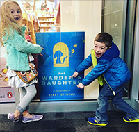Eileen and Jerry Spinelli's grandkids excited to see grandfather's book cover in bookstore window