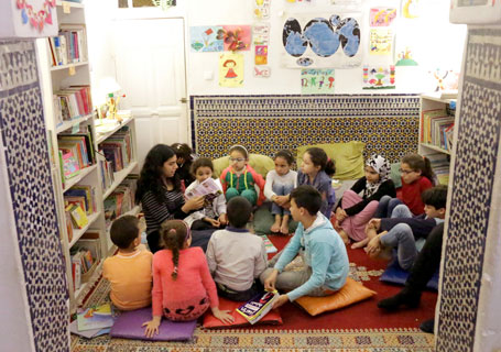 The small, cozy room of the Medina Children's Library is lined with comfortable pillows and rugs and is stocked with a growing collection of books—the stars of the space.