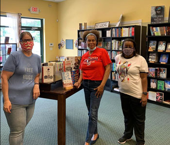 VaLinda Miller (center) owner of Turning Page Bookshop in South Carolina, in her store with local librarian friends Theresa Wagner and Maya Hollinshead. Photo courtesy of Turning Page Bookshop.